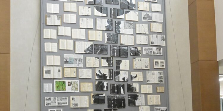 All booked up: Big new art piece hangs at library