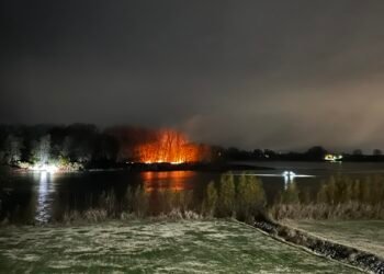 Witness watches people set Henderson Island on fire