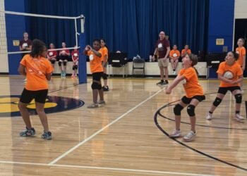 Girls learn volleyball in free, low-stress feeder program