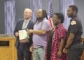 Circle K employee who pushed fiery car away from gas pumps is the city’s Community Spotlight recipient