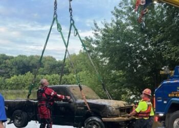 Authorities pull a truck out of Green River and remains inside are believed to be of an Owensboro man missing since 2008