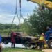 Authorities pull a truck out of Green River and remains inside are believed to be of an Owensboro man missing since 2008